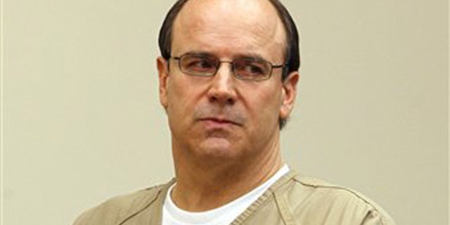 Former Ohio State and NFL quarterback Art Schlichter listens as Judge Timothy Horton reads him his sentence at the Franklin County Common Pleas Court Thursday, Sept 15, 2011, in Columbus, Ohio.
