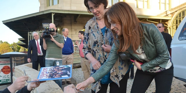 May 3, 2013: The "Office" actors, Phyllis Smith and Ellie Kemper, sign autographs outside the Radisson Lackawanna Station Hotel in Scranton, Pa.