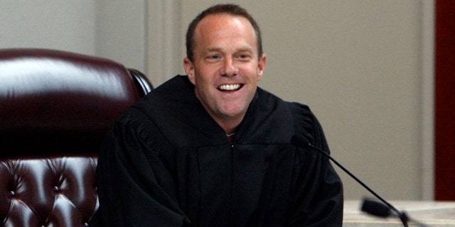 Utah Supreme Court Justice Thomas R. Lee takes his place at the bench after being confirmed by U.S. Supreme Court Justice Clarence Thomas at the Matheson Courthouse, in Salt Lake City. President Donald Trump's list of candidates for the Supreme Court, posted on White House website in November 2017 includes Lee.
