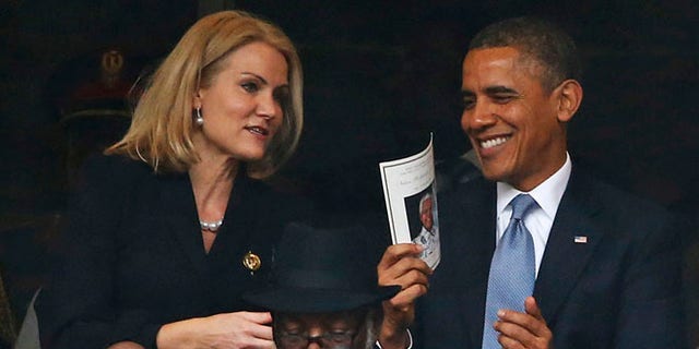 Dec. 10, 2013: President Barack Obama laughs with Danish prime minister, Helle Thorning-Schmidt, during the memorial service for former South African president Nelson Mandela at the FNB Stadium in Soweto, near Johannesburg, South Africa.
