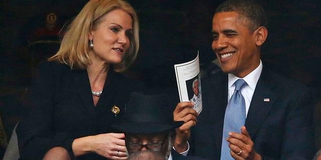 Dec. 10, 2013: President Barack Obama laughs with Danish prime minister, Helle Thorning-Schmidt, during the memorial service for former South African president Nelson Mandela at the FNB Stadium in Soweto, near Johannesburg, South Africa.