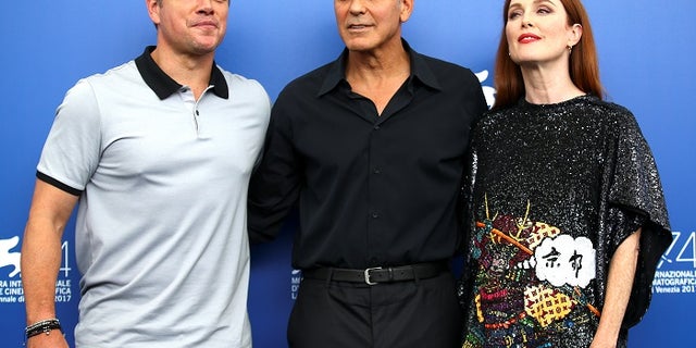 Director George Clooney and actors Matt Damon and Julianne Moore pose during a photocall for the movie "Suburbicon" at the 74th Venice Film Festival in Venice, Italy September 2, 2017. REUTERS/Alessandro Bianchi - RC1CF0310E90