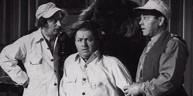 Larry Fine, Curly Jo De Rita, and Moe Howard in a scene from The Three Stooges movie.