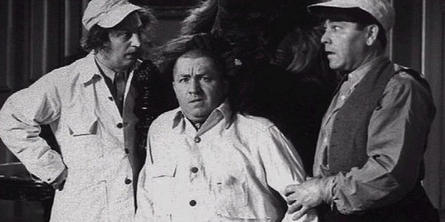 Larry Fine, Curly Jo De Rita, and Moe Howard in a scene from The Three Stooges movie.