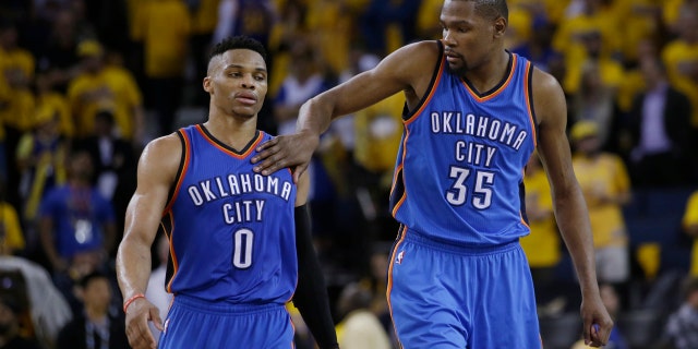 May 16, 2016: Kevin Durant (35) pats Oklahoma City Thunder teammate Russell Westbrook (0) on the shoulder as they take a lead over the Golden State Warriors during the second half of Game 1 of the NBA Western Conference final.