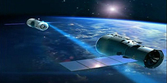A Chinese Shenzhou spacecraft closes in on the country's Tiangong 1 space lab in this still from a mission profile video.