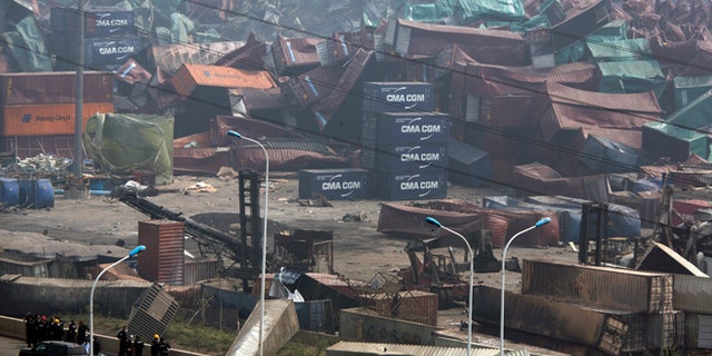 Aug. 15, 2015: Chinese emergency crew survey the site of an explosion in northeastern China's Tianjin municipality. New explosions and fire rocked the Chinese port city of Tianjin on Saturday, where one survivor was pulled out and authorities ordered evacuations within a 1.8-mile radius to clean up chemical contamination.