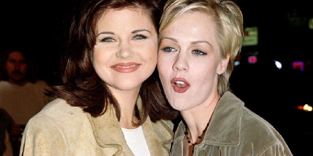 Actresses Tiffany-Amber Theissen (L) and Jennie Garth, stars of the television series "Beverly Hills 90210," arrive as guests for the premiere of actor Jim Carrey's new film, "Ace Ventura: When Nature Calls," November 8. The film is about the adventures of the world's only detective who specializes in finding lost animals - RTXFLU7