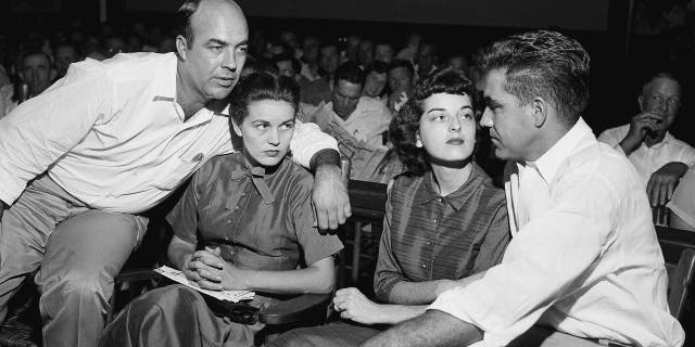 In this Sept. 23, 1955, file photo, J.W. Milam, left, his wife, second left, Roy Bryant, far right, and his wife, Carolyn Bryant, sit together in a courtroom in Sumner, Miss. Bryant and his half-brother Milam were charged with murder but acquitted in the kidnap-torture slaying of 14-year-old black teen Emmett Till in 1955 after he allegedly whistled at Carolyn Bryant.