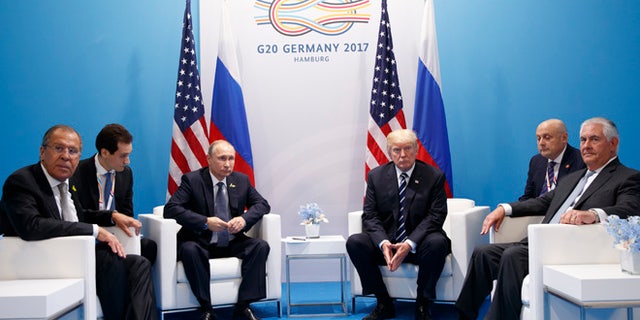 President Donald Trump meets with Russian President Vladimir Putin at the G20 Summit, Friday, July 7, 2017, in Hamburg. Russian Foreign Minister Sergey Lavrov is at left, Secretary of State Rex Tillerson is at right. (AP Photo/Evan Vucci)