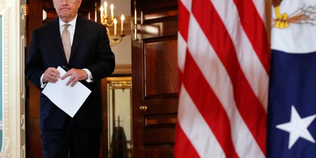Secretary of State Rex Tillerson walks in to a news conference to speak about Qatar at the State Department in Washington, Friday June 9, 2017. Tillerson is calling on Saudi Arabia, Egypt, the United Arab Emirates and Bahrain to immediately ease their blockade on Qatar. (AP Photo/Jacquelyn Martin)