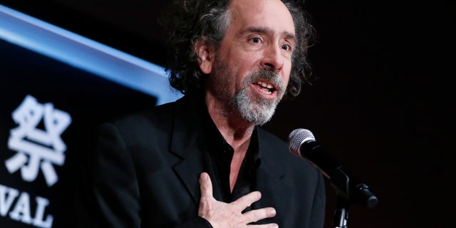 Director Tim Burton speaks as he receives the SAMURAI award during the closing ceremony of the Tokyo International Film Festival in Tokyo October 31, 2014. REUTERS/Yuya Shino (JAPAN - Tags: ENTERTAINMENT SOCIETY) - RTR4CATP
