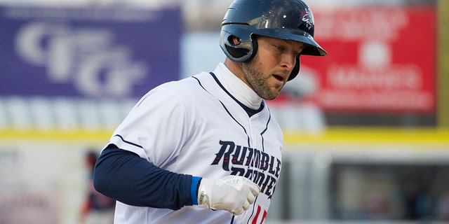 Tim Tebow, playing for the Binghamton Rumble Ponies, rounds third base after hitting a three-run home run in the first inning against the Portland Sea Dogs in a Double-A baseball game Thursday, April 5, 2018, in Binghamton, N.Y. (AP Photo/Matt Smith)
