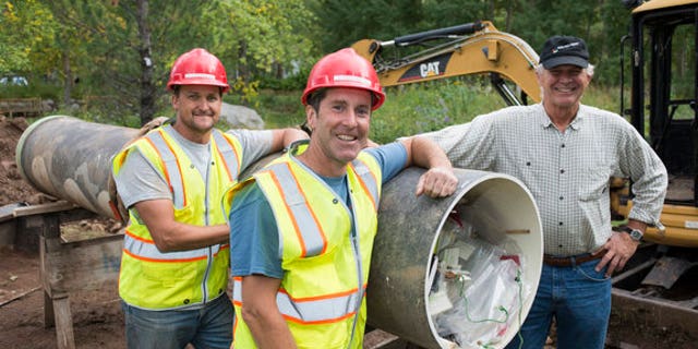 The Diggers team with the rediscovered time capsule from 1983.