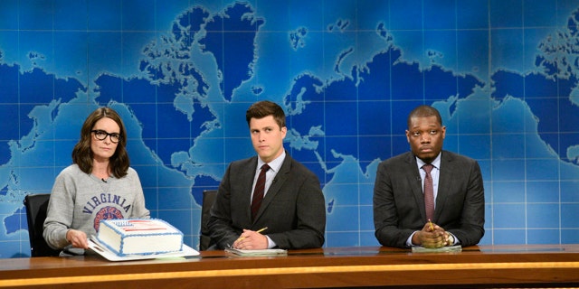 Pictured: (l-r) Tina Fey, Colin Jost and Michael Che at the Weekend Update desk on August 17, 2017.