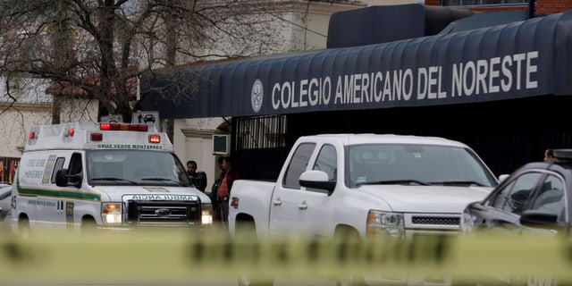 A yellow police line cordons off access to the Colegio Americano del Noreste after a student opened fire.