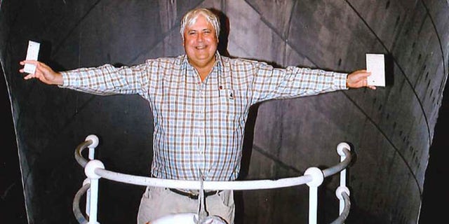 In this April 25, 2012 photo provided by Crook Publicity, Australian billionaire Clive Palmer poses in front of an artist impression of the Titanic ll at MGM Studios in Los Angeles, Ca. Palmer said Monday, April 30, 2012, that he'll build a high-tech replica of the Titanic at a Chinese shipyard and its maiden voyage in late 2016 will be from England to New York, just like its namesake planned.