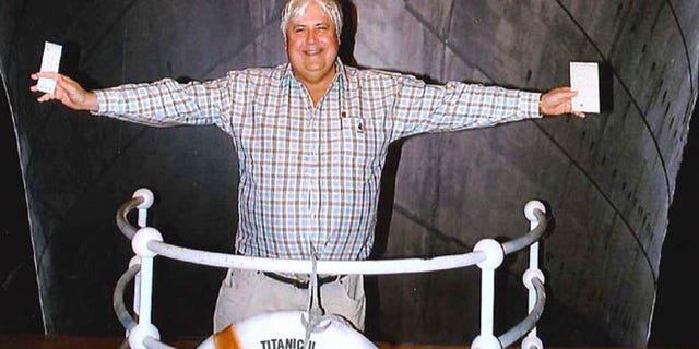 In this April 25, 2012 photo provided by Crook Publicity, Australian billionaire Clive Palmer poses in front of an artist impression of the Titanic ll at MGM Studios in Los Angeles, Ca. Palmer said Monday, April 30, 2012, that he'll build a high-tech replica of the Titanic at a Chinese shipyard and its maiden voyage in late 2016 will be from England to New York, just like its namesake planned.