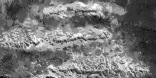 The trio of ridges on Titan known as Mithrim Montes is home to the hazy Saturnian moon's tallest peak. (NASA/JPL-Caltech/ASI)