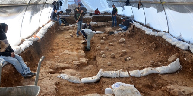 In this undated photo, workers clear a dig site believed to be Jerusalem's 'Third Wall' breached by armies commanded by the Roman emperor Titus in A.D. 70