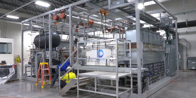 TMGcore's system centers around this device called a skid. It uses two-stage liquid immersion cooling technology to reduce the energy costs of crypto mining.