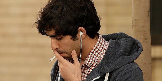 March 1, 2016: A man smokes a cigarette in San Francisco. (AP/Ben Margot)