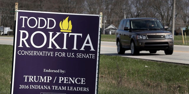 A sign promoting the campaign of GOP Senate candidate Todd Rokita is shown along a state highway in Brownsburg, Ind., Tuesday, April 17, 2018. Donald Trump's re-election campaign has issued a rebuke to Rokita, ordering the Republican to take down yard signs that could give a false impression that Rokita is endorsed by the president, two officials with direct knowledge of the matter told The Associated Press.
