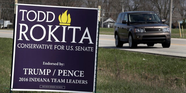 A sign promoting the campaign of GOP Senate candidate Todd Rokita is shown along a state highway in Brownsburg, Ind., Tuesday, April 17, 2018. Donald Trump's re-election campaign has issued a rebuke to Rokita, ordering the Republican to take down yard signs that could give a false impression that Rokita is endorsed by the president, two officials with direct knowledge of the matter told The Associated Press.