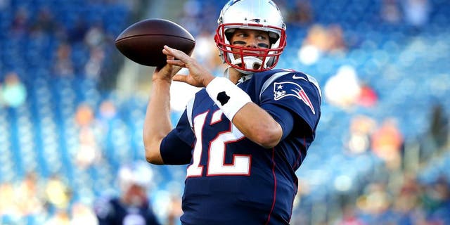 FOXBORO, MA - AUGUST 13: Tom Brady #12 of the New England Patriots warms up prior to a preseason game against the Green Bay Packers at Gillette Stadium on August 13, 2015 in Foxboro, Massachusetts. (Photo by Maddie Meyer/Getty Images)