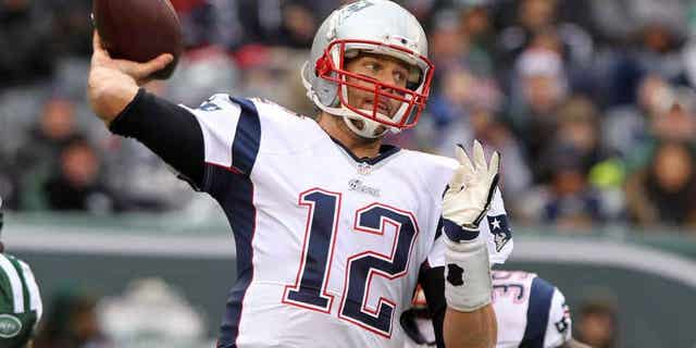 EAST RUTHERFORD, NJ - DECEMBER 21: Tom Brady #12 of the New England Patriots looks to pass during the first half against the New York Jets at MetLife Stadium on December 21, 2014 in East Rutherford, New Jersey. (Photo by Jerome Davis/Getty Images)