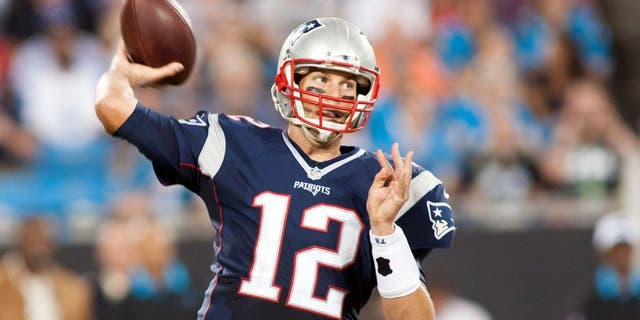 Aug 28, 2015; Charlotte, NC, USA; New England Patriots quarterback Tom Brady (12) passes the ball during the second quarter against the Carolina Panthers at Bank of America Stadium. Mandatory Credit: Jeremy Brevard-USA TODAY Sports