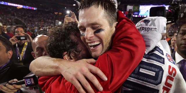 GLENDALE, AZ - FEBRUARY 1: New England Patriots quarterback Tom Brady shares a hug with Patriots defensive coordinator Matt Patricia after winning Super Bowl XLIX. (Photo by Barry Chin/The Boston Globe via Getty Images)