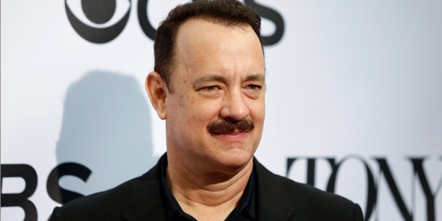 Actor Tom Hanks, nominated for a Tony Award for his acting in the play Lucky Guy, arrives for the 2013 Tony Awards Meet The Nominees Press Reception in New York, May 1, 2013.