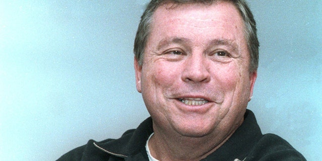 This Oct. 22. 1991, file photo shows actor Tom "Billy Jack" Laughlin talking with residents at Eastern Depot Restaurant in Berlln, N.H. Laughlin, whose production and marketing of "Billy Jack" set a standard for breaking the rules on and off screen, has died.