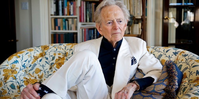In this July 26, 2016 file photo, American author and journalist Tom Wolfe, Jr. appears in his living room during an interview about his latest book, "The Kingdom of Speech," in New York. Wolfe died at a New York City hospital. He was 87.