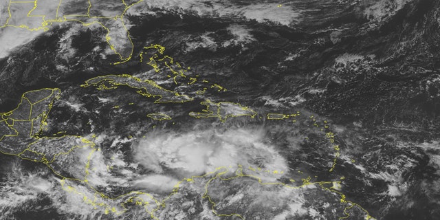 This NOAA satellite image taken Tuesday, Nov. 2, 2010 at 01:45 PM EDT shows Tropical Storm Tomas over the central Caribbean Sea, about 350 miles south of port Au Prince Haiti and 420 miles southeast of Kingston Jamaica. Numbers strong rain showers and thunderstorms cover the waters from the Gulf of Venezuela to the central Caribbean Sea. (AP/WEATHER UNDERGROUND)