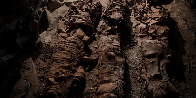 Mummies found in the New Kingdom tomb that belongs to a royal goldsmith in a burial shaft, in Luxor, Egypt. (Credit: Associated Press)