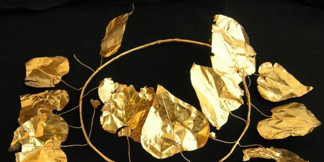 A gold wreath in the shape of an ivy plant discovered at a 2,400-year-old tomb complex in Cyprus.