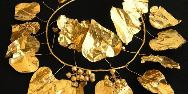 A gold wreath in the shape of an ivy plant discovered at a 2,400-year-old tomb complex in Cyprus.