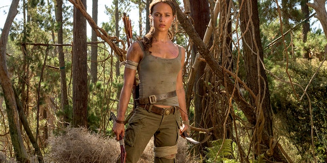 This image released by Warner Bros. Pictures shows Alicia Vikander in a scene from "Tomb Raider." It took weeks of training and plates full of protein to turn former ballerina Alicia Vikander into action star Lara Croft. (Graham Bartholomew/Warner Bros. Pictures via AP)