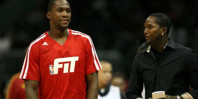Jan 3, 2014; Atlanta, GA, USA; Golden State Warriors point guard Toney Douglas (0) talks to his brother and Atlanta Falcons wide receiver Harry Douglas before a game against the Atlanta Hawks at Philips Arena. Mandatory Credit: Brett Davis-USA TODAY Sports