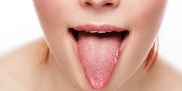 natural tongue open mouth. Studio shot.