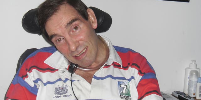 In this recent family photo released by Tony and Jane Nicklinson, former corporate manager, rugby player, skydiving sports enthusiast Tony Nicklinson sits at his home in Wiltshire, England, where following a stroke he suffers from locked-in syndrome and now wants to die.