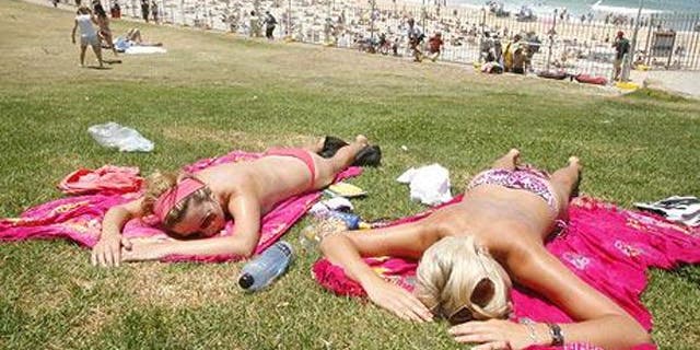 Sunbathers on Bondi Beach in Australia.