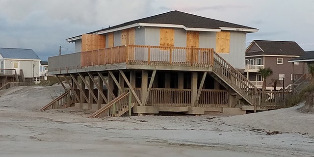 A home boarded up in preparation for Hurricane Florence in Topsail Beach, North Carolina, Wednesday