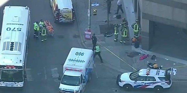 Photos from the scene in Toronto showed bodies in the ground.