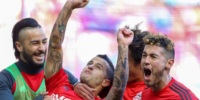 Mar 6, 2016; Harrison, NJ, USA; Toronto FC forward Sebastian Giovinco (10) celebrates his goal against the New York Red Bulls during the second half at Red Bull Arena. Toronto FC won, 2-0. Mandatory Credit: Vincent Carchietta-USA TODAY Sports