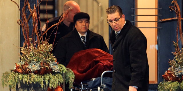 One of two bodies is removed from the home of billionaire founder of Canadian pharmaceutical firm Apotex Inc., Barry Sherman and his wife Honey, who were found dead in Toronto on December 15, 2017.