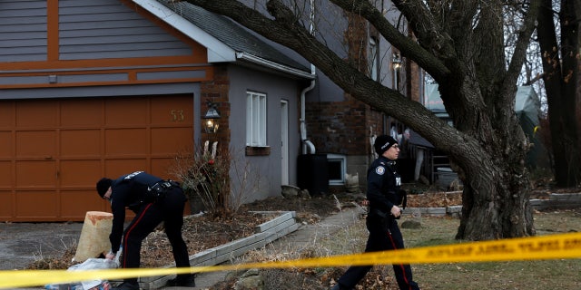 Jan. 29, 2018: Police officers guard the grounds of the property where Bruce McArthur is believed to have buried his victims.