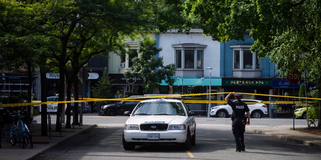 Police at the perimeter of the scene of the shooting in east Toronto.